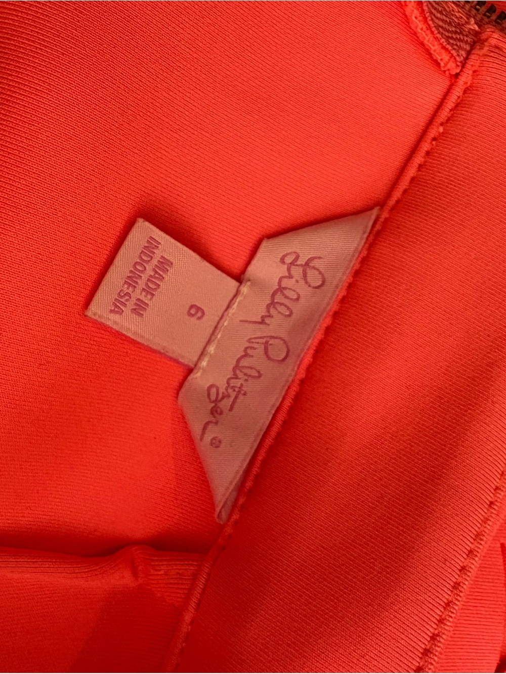 Label Inside Bright Coral Garment